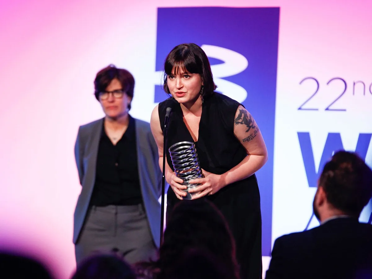 Susan Fowler receiving a Webby Award