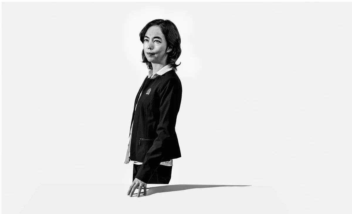 Image may contain Clothing Sleeve Apparel Long Sleeve Coat Human Person Overcoat and Female